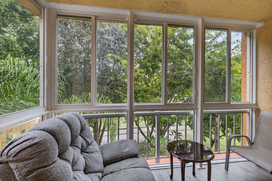 Live comfortably in this beautifully maintained top-floor condo featuring 2 bedrooms and 2 full bathrooms. Step through the impact-rated door to find the kitchen on your right, leading into an open-concept dining and living area. The enclosed balcony, upgraded with impact windows, offers a bright and relaxing space—perfect for reading, unwinding, or scrolling through your phone while enjoying the view.The association allows up to two additional adult residents (18+). The community is well-managed, with maintenance reserves that meet Fannie Mae requirements—making the condo eligible for conventional financing through most lenders. Ample parking is available for owners, adding to the property’s overall ease and comfort.