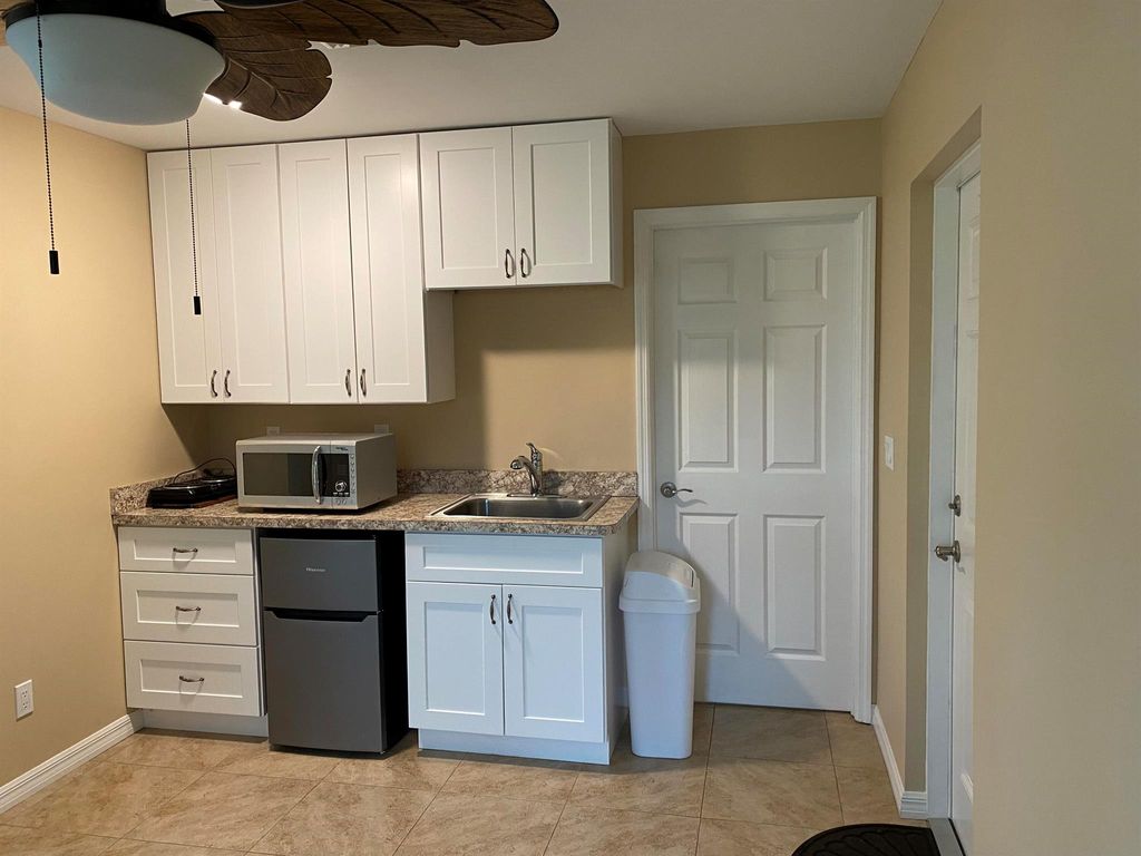 Photo of 437 SW Dagget Avenue, Port Saint Lucie, FL 34953 (MLS # R11011390)