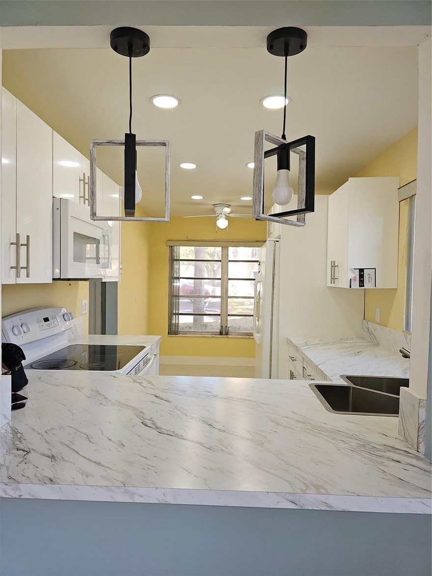 Beautiful 1st floor corner rental in the desirable 55+ community of Bermuda Club in Tamarac! This freshly painted condo features an updated kitchen, brand new white ceramic tile flooring throughout, and abundant natural light from its corner location. Enjoy serene lake views and pool views right from your unit. Convenient parking directly in front of the condo. Community amenities included, plus cable is covered in the association fee. Landlord offering low move-in cost: first month’s rent and security deposit only. Association requires 675+ Beacon score and minimum combined income of $30,000.