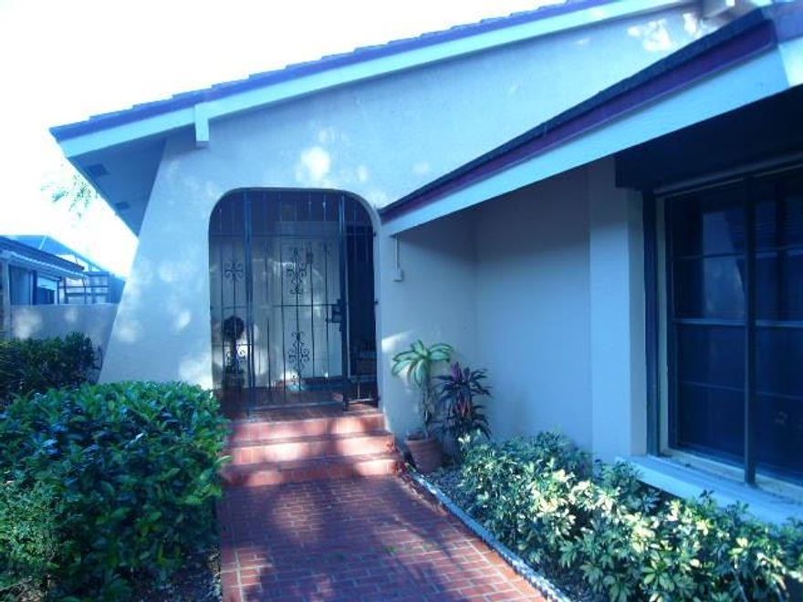 A quiet peaceful tree lined enclave located in the desirable Hollows of Deer Creek. This is a quiet adult oriented country club community without the membership fees. 3 bedrooms, master has huge walk-in closet and 2 baths, well maintained with an interior laundry room, 2 car garage, rear screened porch and patio with a small lagoon pool. One story with an open floor plan. Tiled floors throughout.