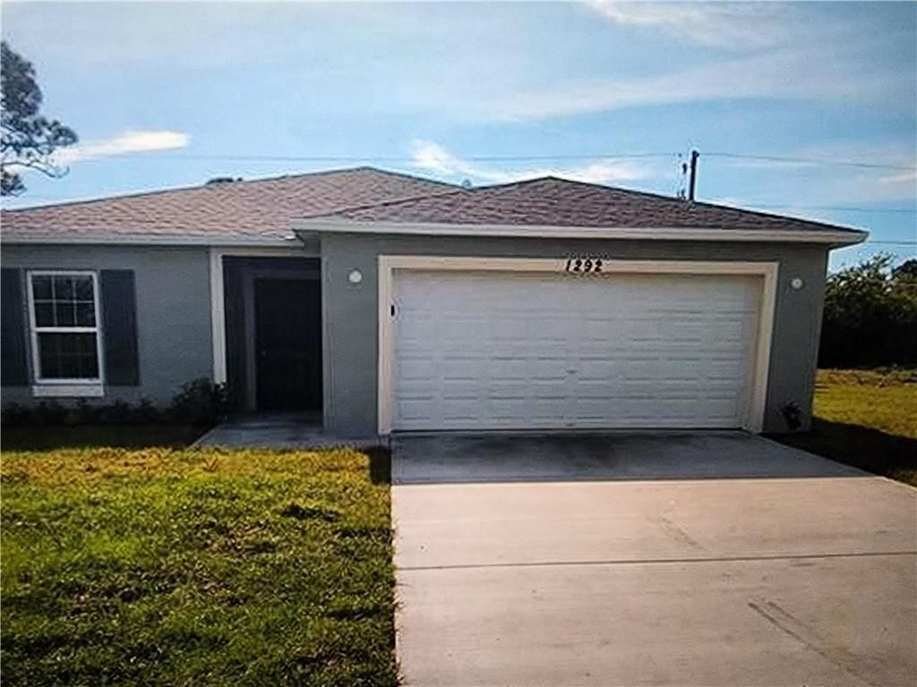 Photo of 1292 SW Lawndale Ave, Port Saint Lucie, FL 34953 (MLS # F10330418)