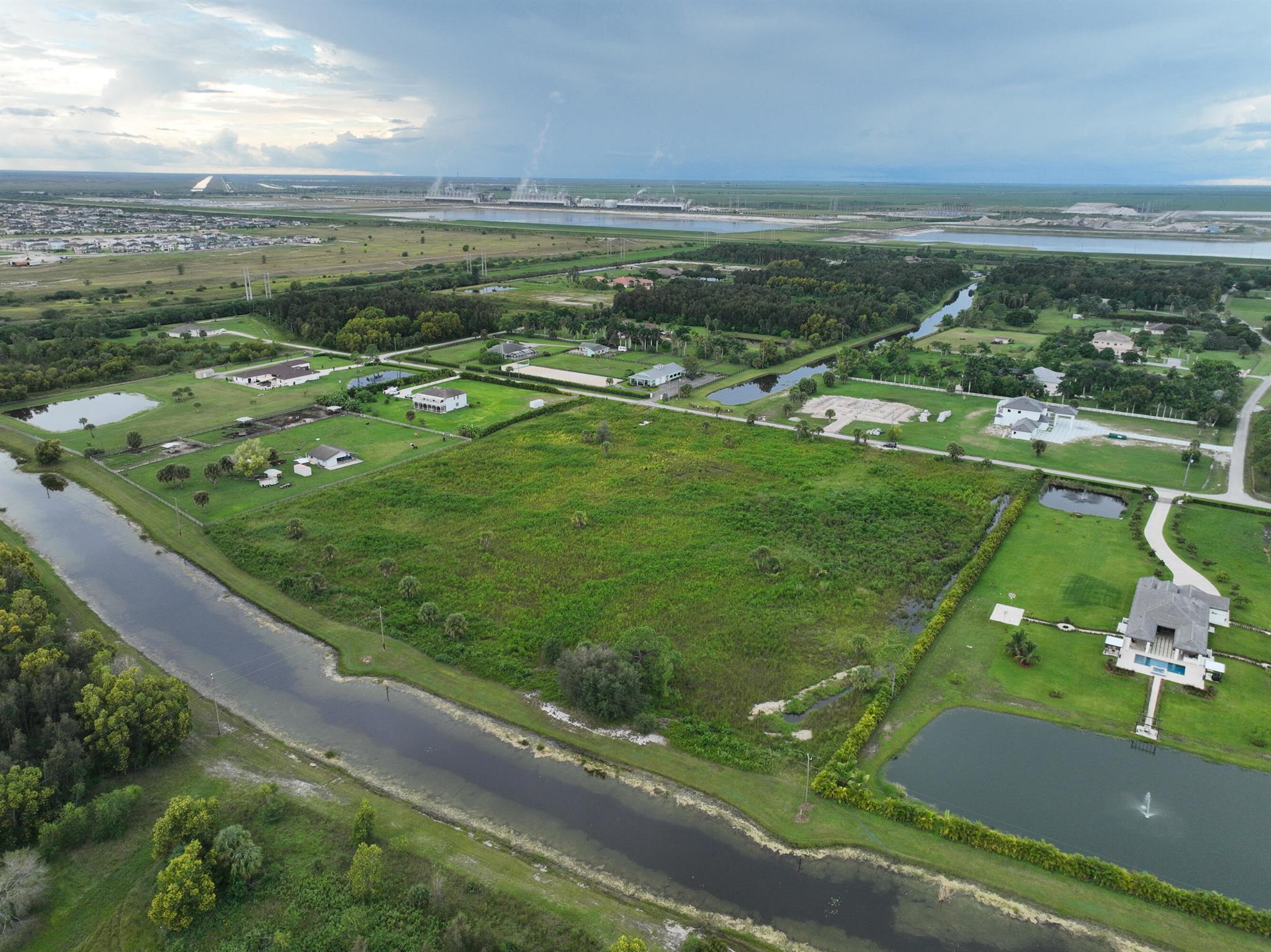 Public Remarks: The land consists of two parcels, Lot 180 and Lot 181, located in Deer Run. Lot 180 spans 5.17 acres, while Lot 181 covers 5.09 acres. These adjacent lots are being offered together at a competitive price. The 2022 taxes for Lot 180 amount to $4619.65, while the taxes for Lot 181 are $4548.15 for the same year. This presents a unique opportunity to own a 10-acre lot. The HOA has recently granted approval for the construction of a covered arena, adding further value to the property. The lot has been cleared and partially filled, making it ready for the construction of your dream farm estate. It is surrounded by stunning homes and is situated alongside a canal. Please note that all sizes mentioned are approximate.