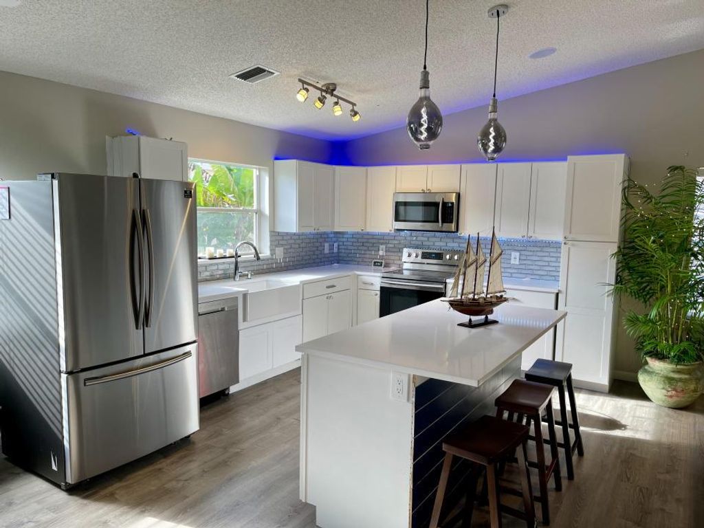 Photo of 157 Caribe Court Ct, Greenacres, FL 33413 (MLS # R10714743)