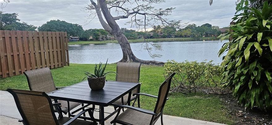 Beautifully remodeled waterfront villa featuring 2 bedrooms and 2 bathrooms, located in the desirable Jacaranda community of Plantation. The flexible floor plan allows for a possible third bedroom or den. . This spacious villa offers a large living and dining area, an updated kitchen with breakfast bar, pantry, and newer appliances. Enjoy a screened patio overlooking the tranquil lake, plus an expansive yard space—perfect for relaxing or entertaining.Two assigned parking spaces plus ample guest parking included. Community amenities feature a pool and park. Superb Plantation location with easy access to major highways, shopping, dining, and everyday conveniences. Quiet setting with beautiful water views—this home is a must-see.