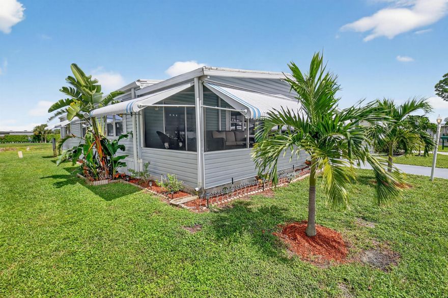 NO LAND LEASE OR LOT RENT!!  Open concept 2 bedroom/2 bath home with a FANTASTIC location in the desirable Jamaica Bay! This unit is situated in the best lot in the park with the lake located behind the unit, you have added privacy and a larger lot!   Kitchen has granite countertops, new luxury vinyl plank flooring, updated bathrooms, new windows in the living areas!  A/C is 2022! Hot water tank 2023, all new tie downs, vapor barrier added! Large walk in closet in primary bedroom and walk out screened patio with cathedral ceilings! The  LOW monthly HOA fee of $250 covers internet, lawn care, water, sewer, trash removal, 24/7 manned gate, on-site management, and amenities include multiple heated pools, library, clubhouse, billiards, bocce ball, putting green, dog park and social events