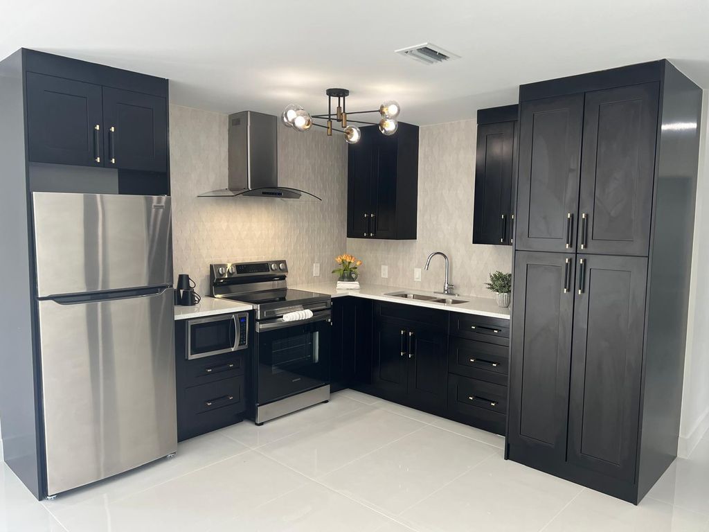 Photo of 1122 Woodbine Road, West Palm Beach, FL 33417 (MLS # R11162217)