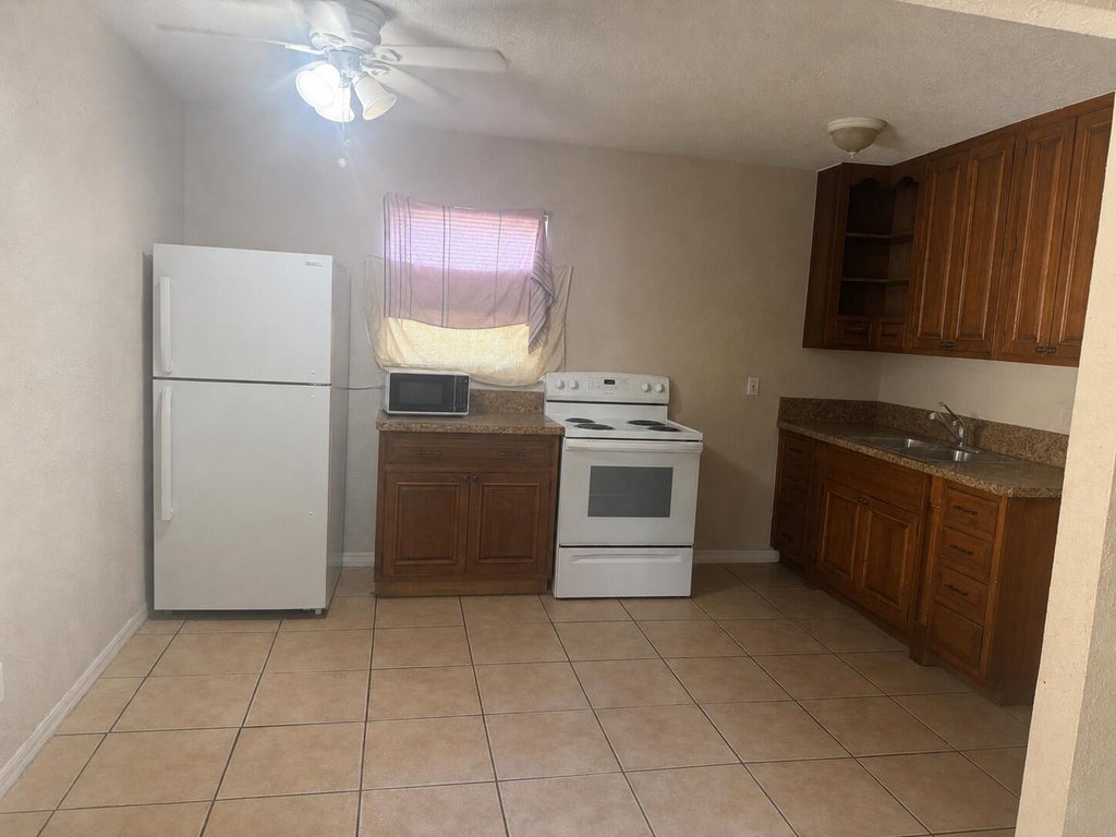 Photo of 1807 Douglas Street S, Lake Worth Beach, FL 33460 (MLS # B26068236)