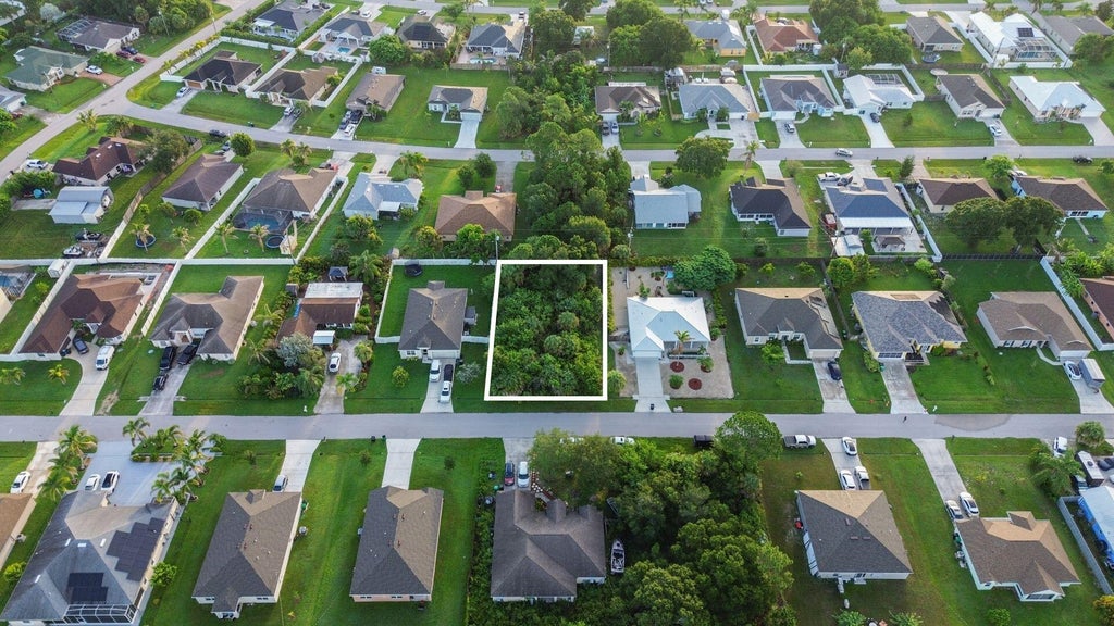 Photo of 3741 SW SWOPE Street, Port Saint Lucie, FL 34953 (MLS # B26071371)