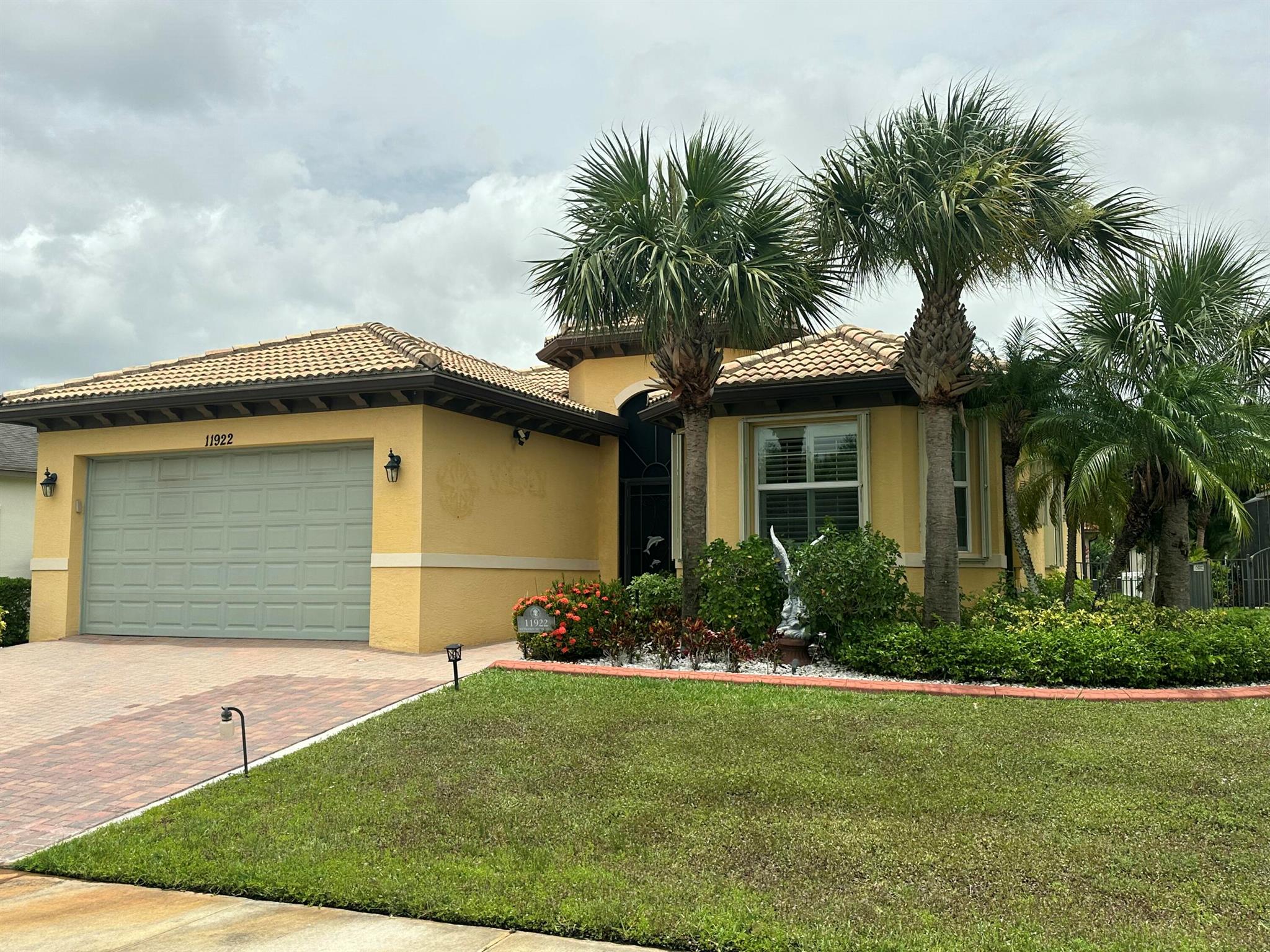 Join Florida's luxury lifestyle in this highly sought after community of Town Park in Tradition. A family oriented development with superior amenities, wide sidewalks, dog parks, tennis courts, kids splash fountains, resort style pool and more. Beautifully designed 3 bed/2/bath home secure with guarded gates. Features tile floors in main areas/GROUT JUSTED cleaned with an open modern kitchen, granite countertops, stainless steel appliances, and an island. The living room's vaulted ceilings provide a spacious feel, the dedicated office/den provides added versatility or 3rd bedroom. Primary suite boasts two walk-in closets, with an oversized tile shower, duel sinks & separate toilet area. laundry room w/new washer/dryer & sink. Exterior of home just painted 6/1725, new fridge-Jan 2025.
