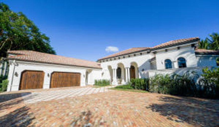 Location location location. Equestrian Club Estate home newly renovated with impact glass and solid mahogany entry doors. This spacious 4 bedroom/5 full bath/2 half bath home offers luxurious living for all. Relax by the sparkling new pool surrounded by Bermuda grass and a fully equipped summer kitchen. All of this, just steps from the horse show. There is not a finer luxury home for the discerning equestrian, desiring space, privacy, and security!