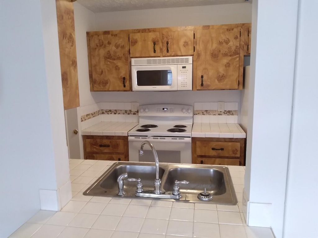 Photo of 554 SW Ester Avenue, Port Saint Lucie, FL 34983 (MLS # R10998044)