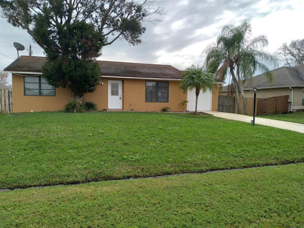 Photo of 554 SW Ester Avenue, Port Saint Lucie, FL 34983 (MLS # R10998044)