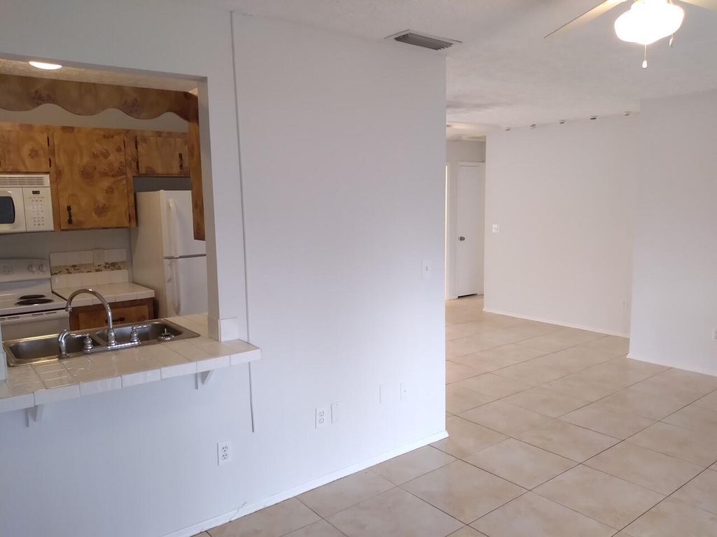 Photo of 554 SW Ester Avenue, Port Saint Lucie, FL 34983 (MLS # R10998044)