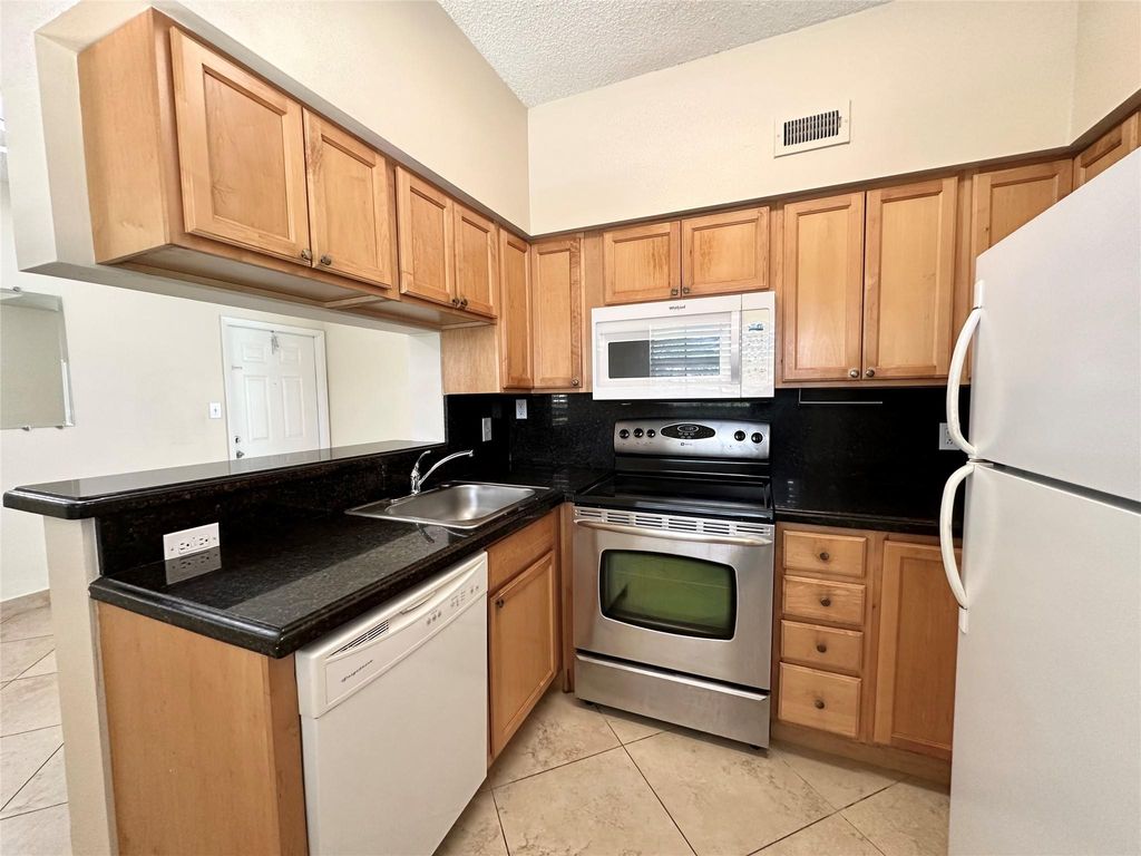 Photo of 621 Cypress Lake Boulevard #B, Deerfield Beach, FL 33064 (MLS # F10505968)