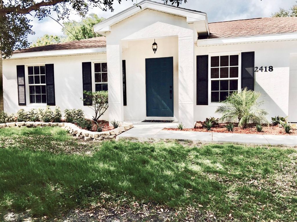 Photo of 2418 SW Carpenter Street, Port Saint Lucie, FL 34984 (MLS # R10798976)