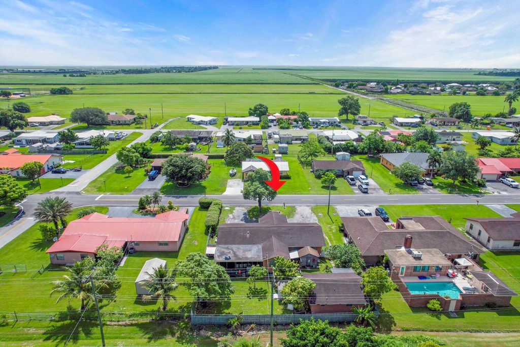 Photo of 504 NE 2nd Street, Belle Glade, FL 33430 (MLS # R11002500)