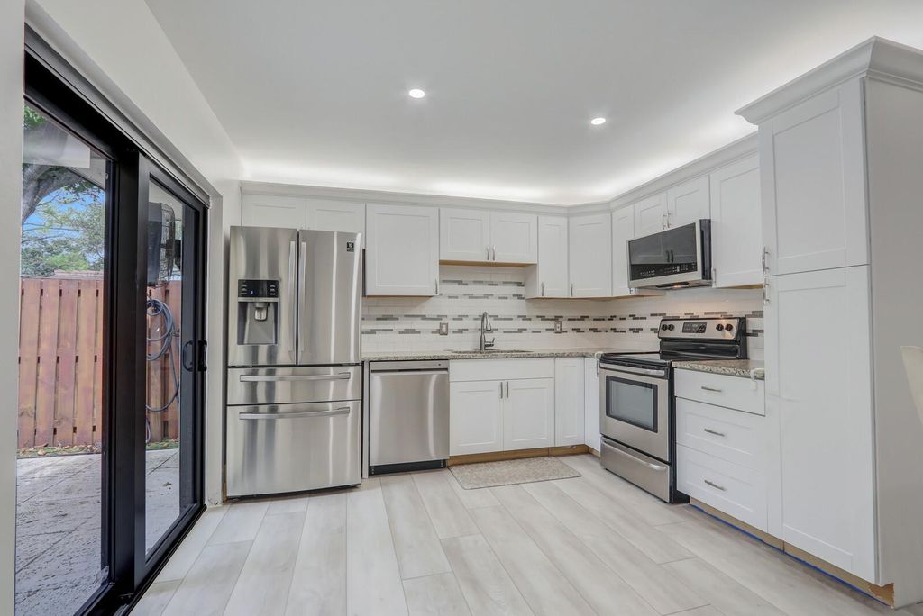 Photo of 730 7th Lane, Palm Beach Gardens, FL 33418 (MLS # F10527054)