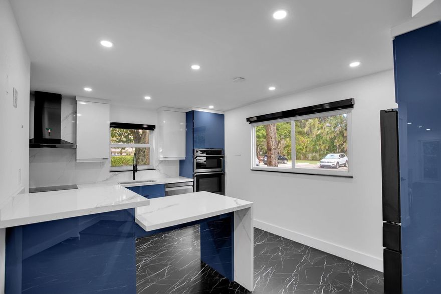 Experience the epitome of elegance and modern living in this breathtaking home, where every detail reflects a commitment to innovation and award-winning design. With impact windows, a well-designed patio enclosure, and a secure front door, every aspect of this home prioritizes safety and comfort. The kitchen is a culinary dream, featuring sleek quartz countertops and a full-sized front-loading washer and dryer for ultimate convenience. the interior boasts smooth ceilings with recessed lighting. Each closet is custom-made to maximize space and style. With two master suites in a well-designed split-bedroom layout, this condo is perfect for both relaxation and entertaining. Browse through the stunning photos, and then come see this incredible property for yourself—you won't want to miss it!