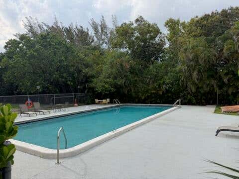 Photo of 3000 Riverside Drive #201-1, Coral Springs, FL 33065 (MLS # B26037829)