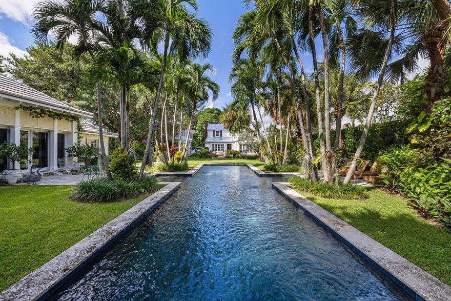 Discover the pinnacle of South Florida living with this exceptionally rare family compound in West Palm Beach's sought-after South End neighborhood. Set on a rare 23,958 sq ft (.55 acre) lot, this one-of-a-kind property is a private oasis featuring lush, meticulously designed gardens and a serene lap pool.The estate includes a charming main house and two newly constructed guest houses, masterfully designed by Roger Janssen and built by Tim Benitz, seamlessly blending timeless elegance with modern comfort. Enjoy leisurely walks along the Intracoastal Waterway via your exclusive private easement on South Flagler Drive, and immerse yourself in the vibrant lifestyle West Palm Beach is known for. With premier dining, luxury shopping, and world-class amenities just minutes