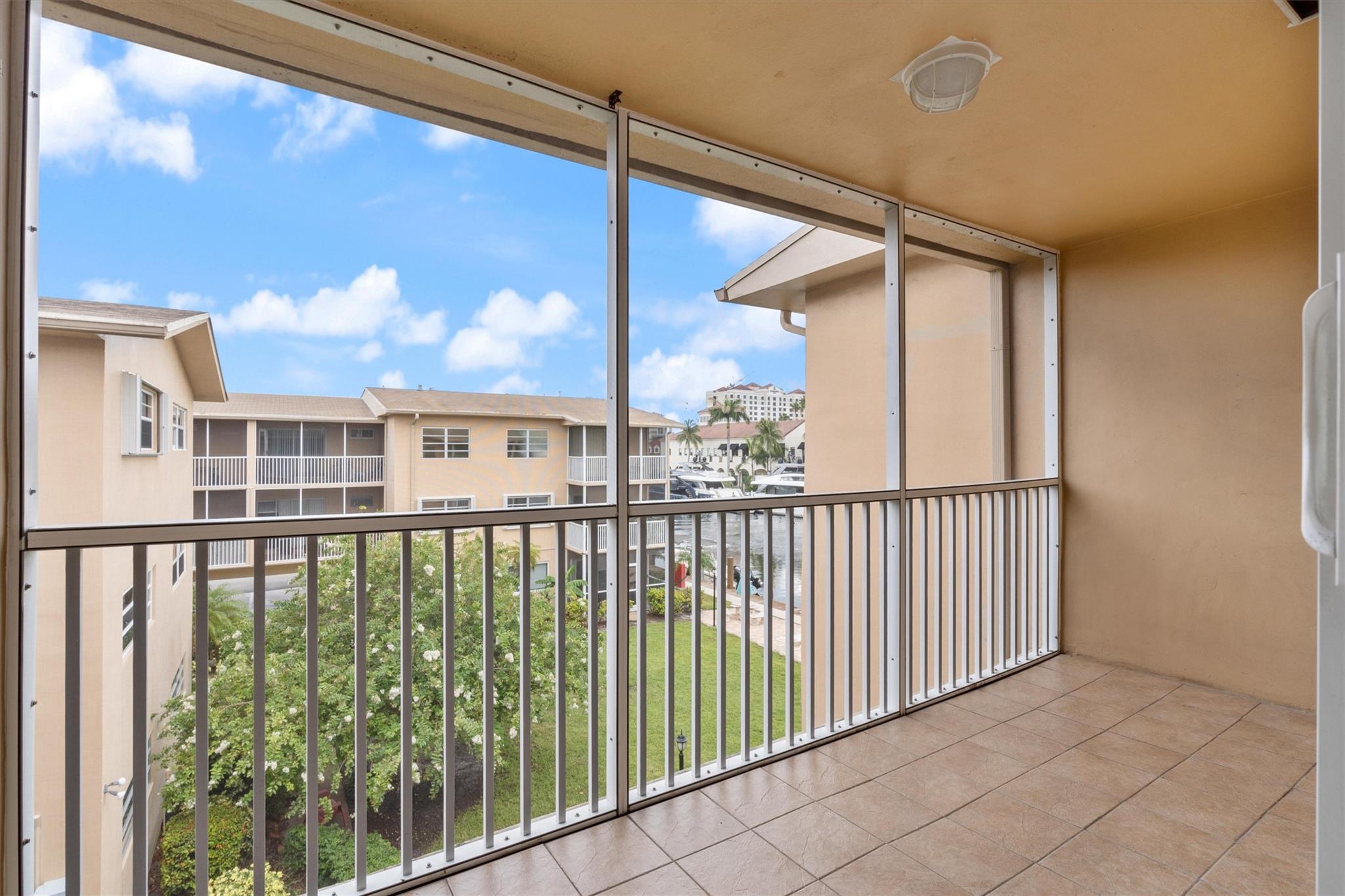 Move-in ready 1bedroom/ 1 bath unit. Spacious third floor unit in a secure gated complex. Oversized & tiled screened-in balcony overlooking the garden and a canal. Other features include impact windows, bamboo floors, remodeled kitchen with granite countertops, stainless steel appliances, and a convection stove/oven. Washer/ dryer will be installed in the unit prior to tenant's move-in. Updated bathroom. Gated under cover parking spot. Available for a yearly rental. No pets are allowed. Desirable east side location just a short drive to the beach, downtown or the airport.