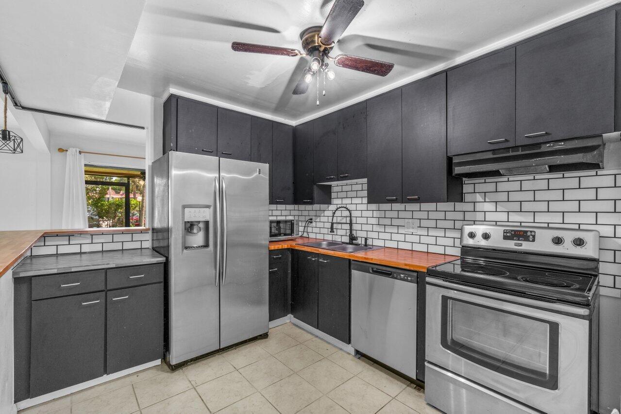 Location! Location! Fantastic, spacious 3 bedroom/2 bath annual unfurnished rental in the heart of Boca Raton. Beautiful kitchen with stainless steel appliances (brand NEW dishwasher); modern/industrial light fixtures and interior design; full-sized washer and dryer in unit; screen-enclosed patio perfect for outdoor lounging and/or dining; and so much more! 1 bedroom + 1 bath located on the ground floor and 2 bedrooms + 1 bath upstairs. 1 assigned parking space and 1 guest parking space (HOA permits 2 cars per unit). Non-aggressive dog breeds considered on a case-by-case basis: 1 dog under 25 lbs. at maturity considered with $350 non-refundable pet fee. Boca Village amenities include a community pool and tennis court.Being minutes from FAU, I-95, Baptist Health Boca Regional Hospital,