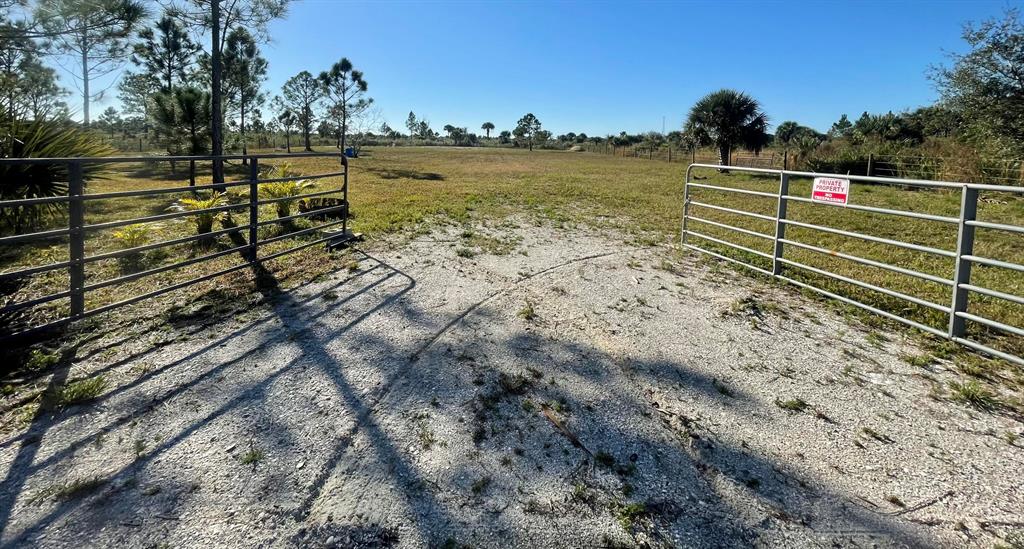 Viking- 1.25 Acre hidden gem! Look no further this property is camping and build ready. Completely cleared, fenced, culvert installed with shell drive, double entry gate, two shell pads for camping, well, well pump, plastic storage shed, swing hung from shade trees, palms planted along NE corner fence line, fire pit, & survey all inclusive! Zoned residential. Approved for the placement of a manufactured home or custom built home. Not ready to build? Escape the city lights for a weekend of bird watching, horseback riding, ATV ride on your property (not permitted on roads),camping & bbq under the starry sky! Surrounding properties are currently wooded and unimproved. This location boasts privacy. Located near the Kissimmee Prairie State Preserve Park
