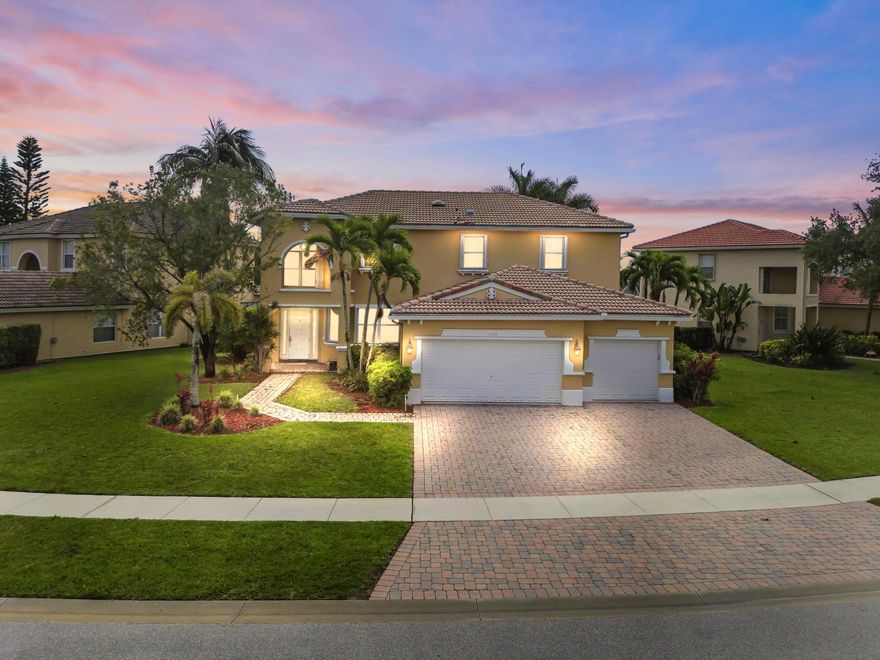Welcome to this stunning waterfront home in the desirable Journey's End community! This gated neighborhood in Lake Worth offers a perfect blend of comfort, style, and family-friendly living.  This spacious 2-story residence features 5 bedrooms, 3 bathrooms, and 2,816 sqft of living space. Enjoy peace of mind with accordion shutters on all windows and a 3-car attached garage, plus an extended driveway for additional parking.   Step inside to find a thoughtfully designed layout with tile and hardwood flooring throughout. The home boasts a large family room and a beautifully appointed kitchen featuring granite countertops, a huge kitchen island, a walk-in pantry, and ample cabinet storage perfect for both everyday living and entertaining. The laundry room is conveniently located just off the kitchen and includes a washer and dryer.  Upstairs, the expansive master suite offers a private retreat with a sitting area, office space, and a luxurious bathroom featuring a Roman tub, a separate shower, and custom California Closets.  Step outside to your own backyard oasis featuring a custom pool and spa overlooking serene lake views, ideal for relaxing or entertaining guests.  Journey's End is a beautifully maintained, family-oriented community offering resort-style amenities, including tennis courts, pickleball courts, a basketball court, a playground, a community pool, and scenic lakes for your enjoyment.  Don't miss the opportunity to own this exceptional waterfront home in one of Lake Worth's most sought-after gated communities!