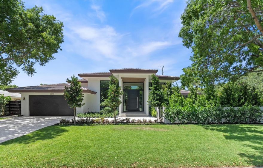 Introducing 2265 NE 30th Ct., designed by Tuthill Architecture and built by Naderi Developments. Situated on an 11,630 sqft lot, this single-story home boasts 3,545 sqft under air with expansive ceiling heights up to 15', 4 bedrooms, a den/office, and 5 full bathrooms. The 2-car garage includes a car vacuum and EV charger ready for added convenience. The kitchen features custom Italkraft Italian cabinetry, a Thermador 36'' refrigerator and 36'' freezer, Bosch Benchmark dishwasher, speed oven, wall oven, induction cooktop, reverse osmosis water filtration, and leathered Quartzite Taj Mahal countertops. Entertaining is made easy with a motorized recessed bug screen, indoor/outdoor Sonos speakers, a summer kitchen with a 40'' grill, and a 15' x 32' saltwater pool.