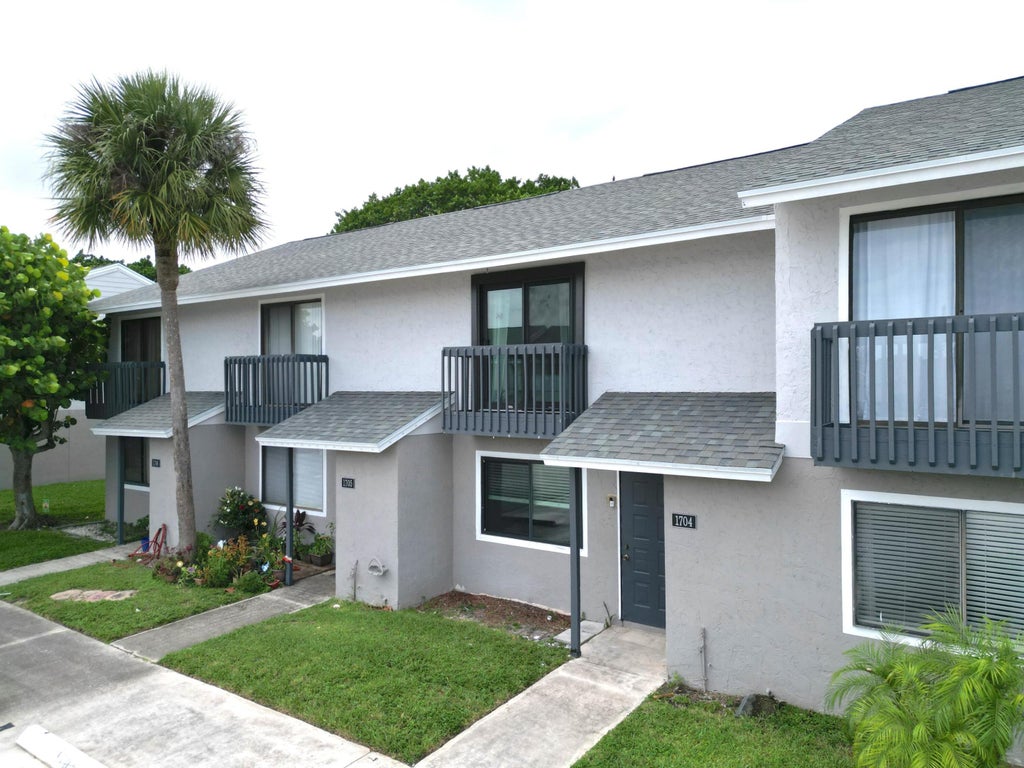 Photo of 1704 Wharf Lane, Greenacres, FL 33463 (MLS # R11003910)