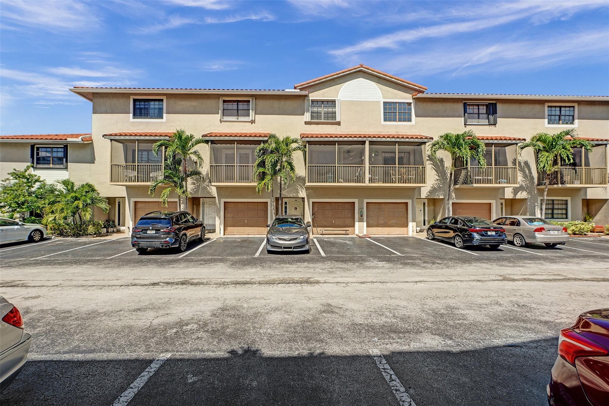 Welcome to this spacious 3 bed / 3.5 bath townhouse in the Banyan Tree community at The Hammocks. Each bedroom features a private en suite bathroom, 1 suite located on the main floor alongside the laundry area and garage. The 2nd level boasts the main living space with kitchen, half bath, and a screened-in balcony, while 2 addn'l bedroom suites are on the 3rd floor. Upgrades include: Newer Roof, 2021 AC & hot water heater, 2023 Hurricane impact windows & doors. Washer/dryer & window treatments including motorized blinds in living room & blackout curtains convey. 2 reserved parking spaces in front of unit. HOA includes: 2 pools, tennis courts, gym, lakefront bike trails, beaches w/ pavilions, 24/7 security, cable, trash, exterior maintenance, landscaping, and master insurance.