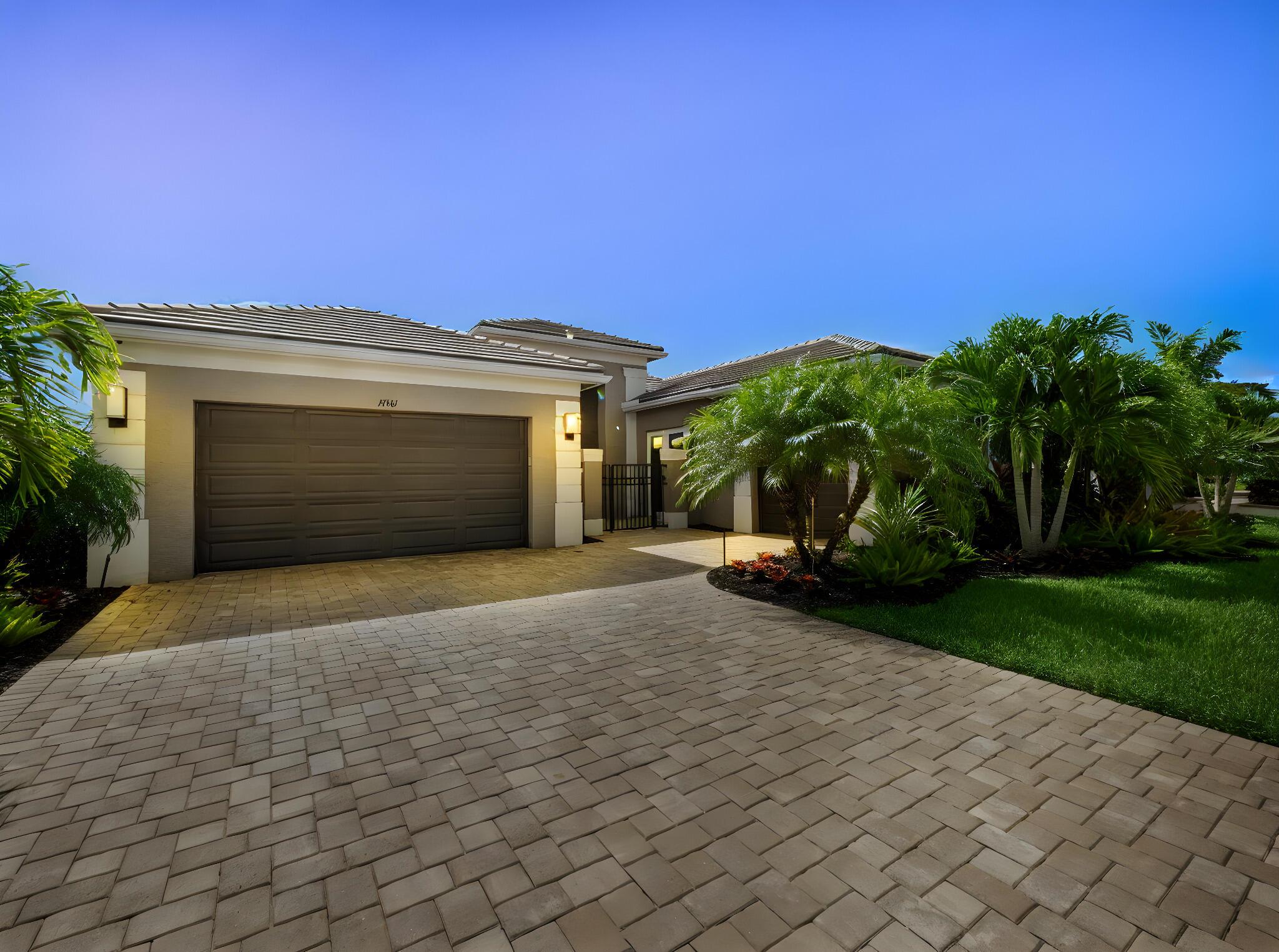 Welcome to this beautifully appointed 3-bedroom + Club Room, 3.5-bathroom lakefront home located in the sought-after 55+ community of Valencia Cay at Riverland. Situated on a premium waterfront lot, this elegant residence showcases high-end upgrades and thoughtful customizations throughout. Step inside to find exquisite porcelain tile plank flooring, custom window treatments, and refined crown and base molding that elevate the space. The open-concept living area is anchored by a custom wall unit and an elegant fireplace, with coffered ceilings adding architectural charm. The chef's kitchen features a striking backsplash, premium cabinetry, and stainless steel appliances--perfect for entertaining guests or enjoying a quiet evening at home.