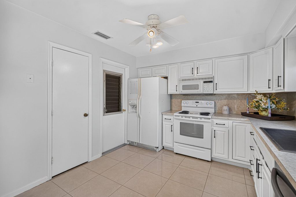 Photo of 9830 Bischofia Tree Way, Boynton Beach, FL 33436 (MLS # B26044662)