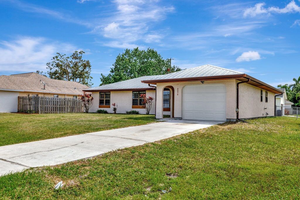 Photo of 2274 SE Seamist Street, Port Saint Lucie, FL 34952 (MLS # R11077401)