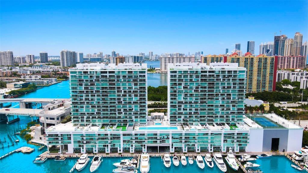 Luxurious 4/4 waterfront Residence in Sunny Isles. This exquisite residence is poised to offer a lifestyle of unparalleled luxury and comfort. Nestled in a premier high-end building this property delivers both sophistication and breathtaking views. Gaze out over the azure water from every room, with floor-to-ceiling windows that seamlessly blend indoor and outdoor living. Spacious Open Concept Design: The expansive living area is perfect for entertaining and family gatherings. High ceilings and designer finishes create an inviting atmosphere, while the state-of-the-art kitchen boasts top-of-the-line appliances, sleek cabinetry, and a generous island. Situated in one of Florida's most sought-after neighborhoods, minutes away from fine dining, upscale shopping, and vibrant nightlife.