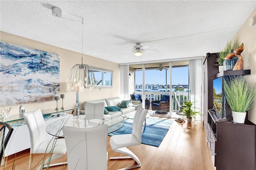wow ! This renovated penthouse unit in a secure all age building is the one you have been looking for. Starting with the updated kitchen that has a beautiful granite counter, moving into the large dining/living room area that leads to a large Florida room. Imagine sipping wine in that large Florida room while taking in an incredible sunset.  Large patio doors in the living room and bedroom gives the unit an amazing amount of natural light and great views of the skyline. Property has a murphy bed in the living room for your overnight guests. Great high end furniture is included in this deal !  Newer AC installed in 2019 Cable included in the maintenance fee.Very active clubhouse that includes 3 pools, tennis, pool tables, bowling alley, barbcues, secured gate. Covered parking WILL NOT LAST