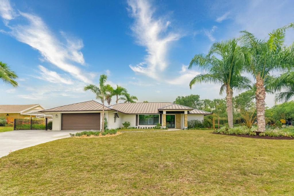 Photo of 1489 SW Pine Tree Lane, Palm City, FL 34990 (MLS # R11154331)