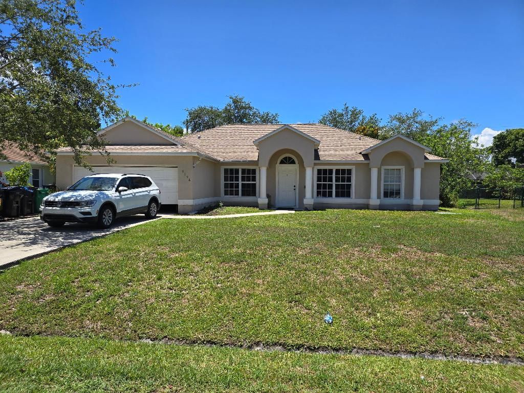 Photo of 1196 SE Puritan Lane, Port Saint Lucie, FL 34983 (MLS # R10990927)