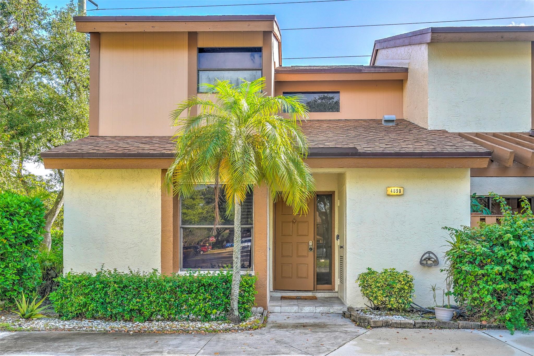 Ideally located in the vibrant and sought-after community of Tartan at Coconut Creek. This attractive corner unit townhouse is a perfect haven for a family, couples, or a single person. The home has laminate floors throughout with the exception of the kitchen & bathroom which has tile floors. The downstairs bedroom is currently used as an office. Enjoy the outdoors on your screened enclosed patio with family & friends or take a stroll to the pool or the park nearby. This spacious and bright home offers a welcoming atmosphere ideal for modern living. Located close to Promenade at Coconut Creek, supermarkets, restaurant, high schools and college. Easy access to highway.