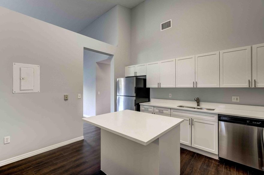 Enclave Community of luxurious 1,600 sq. ft. condo homes featuring a spacious primary suite with en-suite bath, large second bedroom, and a full guest bathroom. Oversized kitchen with stainless steel appliances and quartz countertops. Expansive great room with high ceilings, wood laminate floors, and carpeted bedrooms. Community amenities include a hotel-style pool, picnic area, and walking paths. Conveniently located near shopping, dining, beaches, downtown West Palm Beach, PBI Airport, and Brightline.