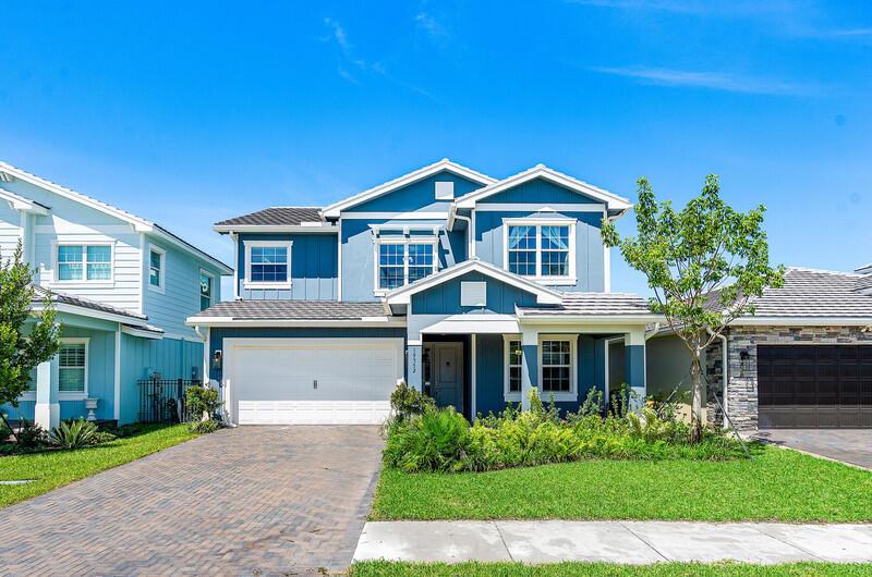 Discover the best resort style community in Loxahatchee, with the charm of modern farmhouse living. This spacious 5-bedroom, 4-bathroom home, built in 2023, offers a perfect blend of contemporary design & comfortable living, on one of the best lots with a beautiful view overlooking the water. With 9 ft ceilings, the heart of the home is the gourmet kitchen featuring a large island, and stainless steel appliances, including a gas range - and opens up into the downstairs living room. There is an additional living space upstairs that could be used as a home office, playroom, or media room for guests or other family members.The primary suite features dual sinks, a soaking tub, a spacious shower, and 2 walk-in closets. Three additional well-appointed bedrooms offer ample space for family.