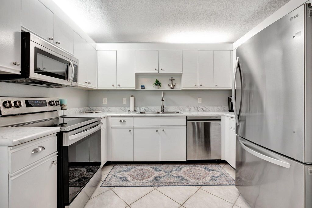 Photo of 380 Prestwick Circle Circle #1, Palm Beach Gardens, FL 33418 (MLS # R11087715)