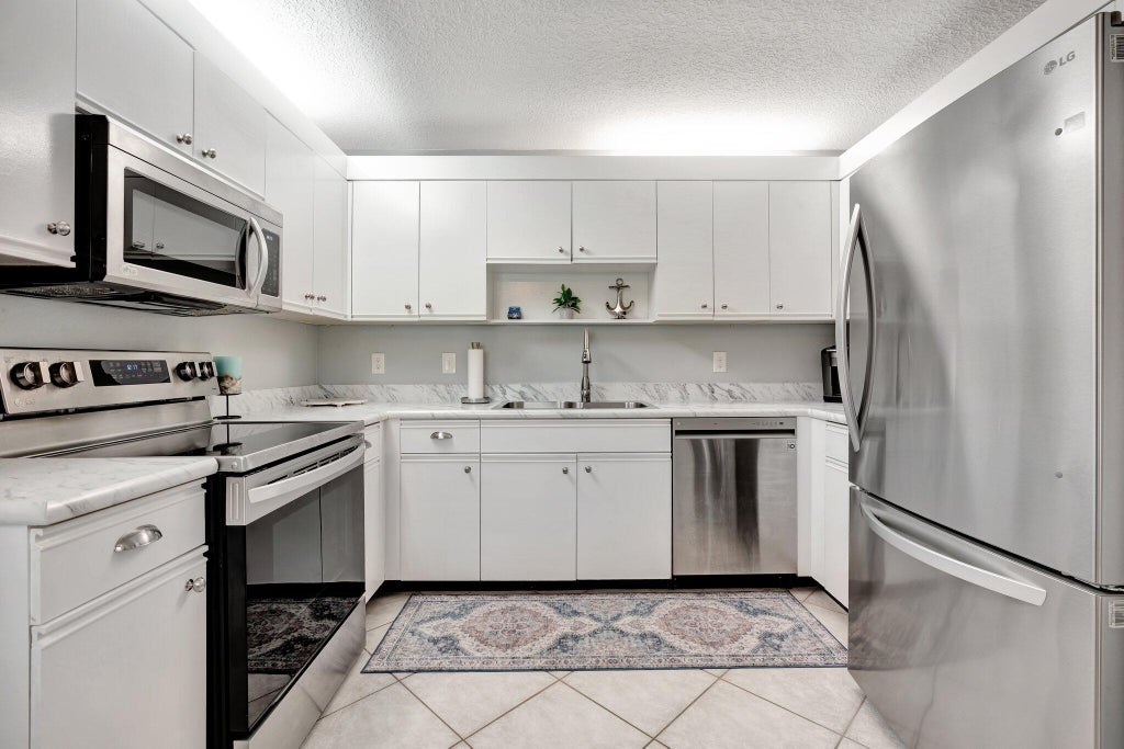 Photo of 380 Prestwick Circle Circle #1, Palm Beach Gardens, FL 33418 (MLS # R11087715)