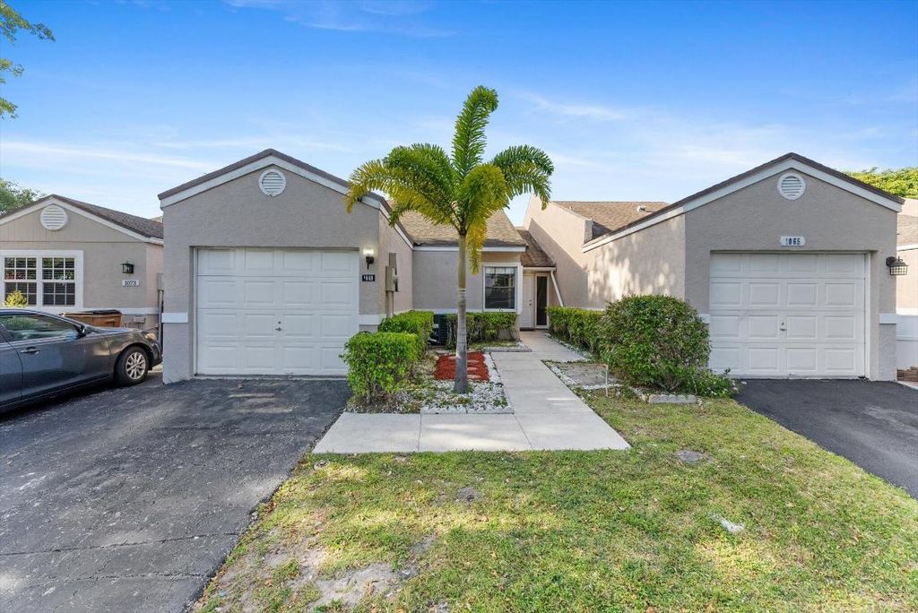 Photo of 1069 NW 50th Drive, Deerfield Beach, FL 33064 (MLS # R10979573)