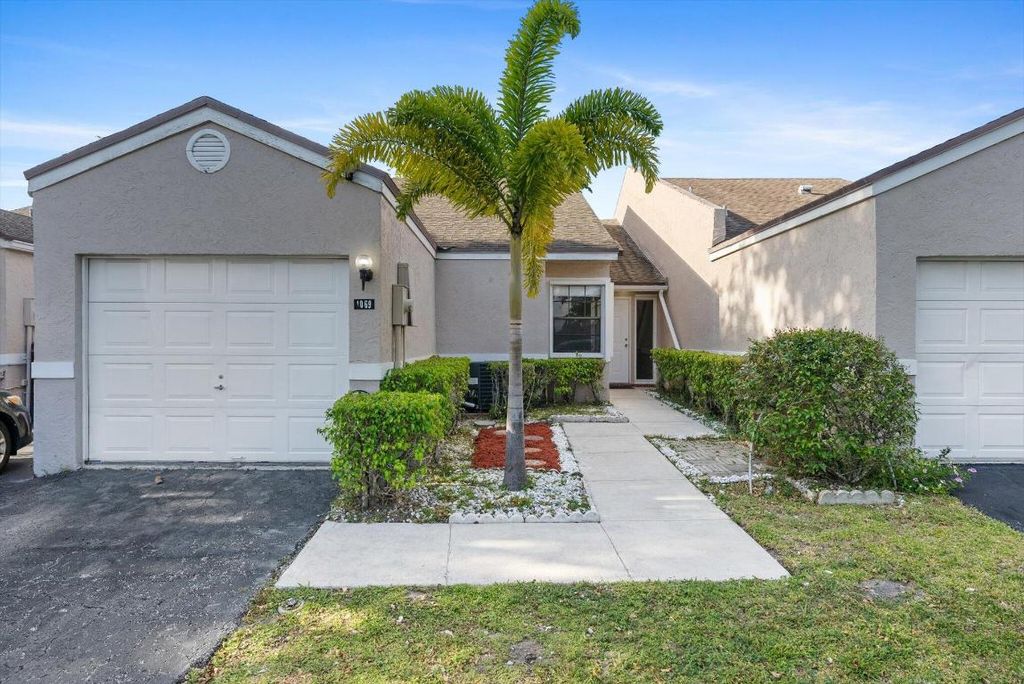Photo of 1069 NW 50th Drive, Deerfield Beach, FL 33064 (MLS # R10979573)