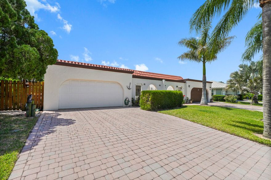 Amazing opportunity to own in the prestigious community of Stuart Yacht and Country Club.  This beautiful villa offers a fantastic floor plan, wonderful 12 foot ceiling and tons of natural light.  As you enter the home you immediately feel the open space this home offers, with a large great room, which perfectly blends with the updated kitchen and dining area.  The homes decor is accentuated with a beautiful custom hard wood sail boat mast as the center piece of the breakfast area as you enter the kitchen.  This is a conversation piece of its own.   The primary bedroom is massive with a large sitting area and plenty of room for a home office. The primary bedroom offers a large walk-in closet, and the primary bath has a double vanity, and combo tub/shower.   The oversized backyard has a large wooden deck and room for a pool if you desire.  You will love this community which offers a manned guard gate.  The community is truly beautiful with golf courses and waterways throughout.  Membership is not mandatory, but there are a variety of memberships available for golf, social, and sport options. This home has been very well maintained with a new A/c in 2025 and all other systems are updated and in great condition.  Close to everything Stuart has to offer, and easy access to the Palm Beaches.  Close to fine dining, entertainment, and the beaches.