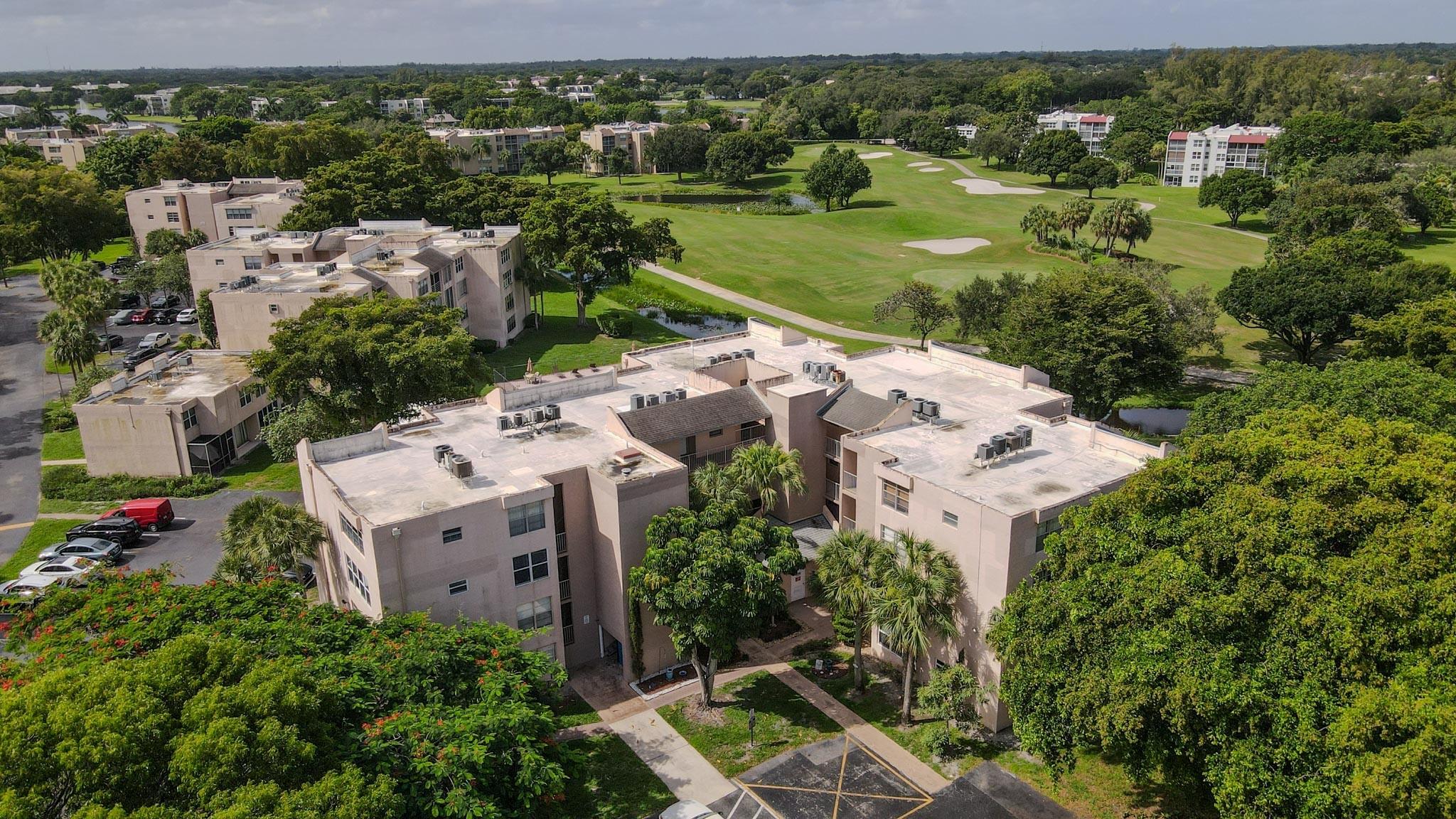 Presenting this desirable ground-floor unit with beautiful views of the golf course and water, located within the prestigious Pine Island Ridge Country Club. Residents enjoy a wide array of amenities, including an 18-hole golf course, two restaurants with lounges, tennis courts, pickleball courts, bocce ball, basketball courts, a children’s park, two swimming pools, barbecue areas, and separate his-and-hers saunas, steam rooms, and locker facilities, along with convenient golf bag storage. Ideally situated near Nova Southeastern University and offering easy access to major highways including I-595, the Turnpike, I-95, and I-75