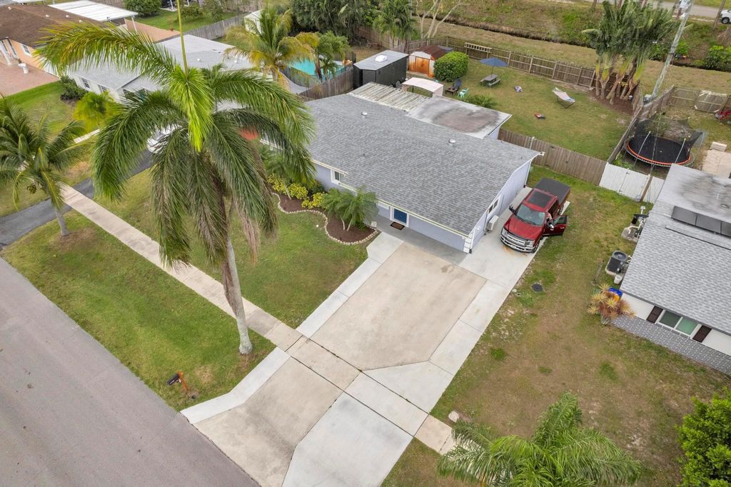 Photo of 441 Cypress Lane, Palm Springs, FL 33461 (MLS # F10496383)