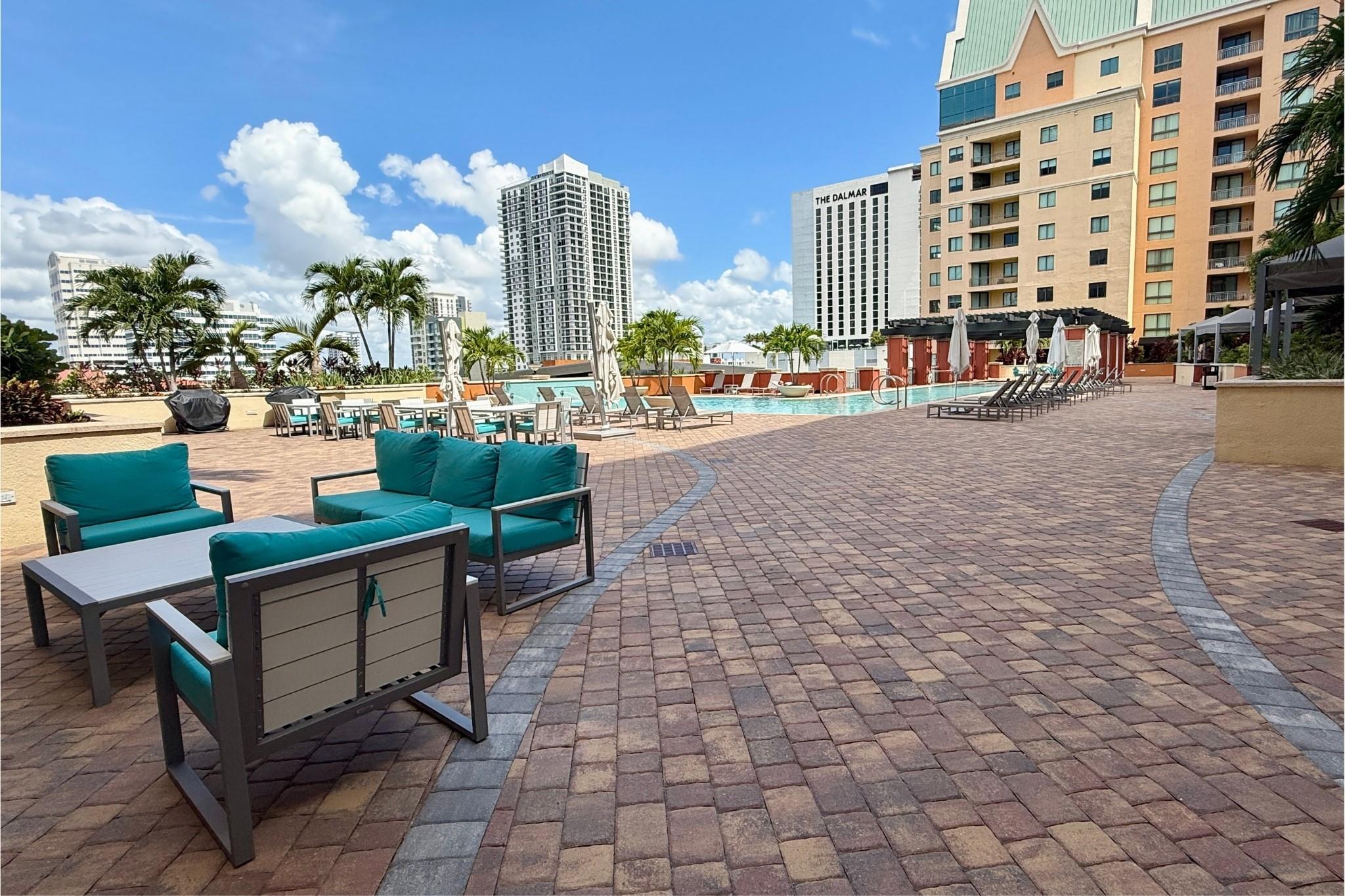 Rare 3BR/2BA furnished condo in prime downtown Fort Lauderdale location sits high on the 11th floor! Includes 3 dedicated GARAGE SPACES—ideal for professionals or families. Features 2 full bedroom sets + den, spacious living & dining areas, in-unit laundry, and valet service for guests. Resort-style amenities include a rooftop pool with cabanas and hot tub, a state-of-the-art fitness center, private movie theater, game and meeting rooms, and 24-hour security. On-site dining at street side Café adds to the convenience. Just steps from Las Olas Boulevard’s top restaurants, shops, galleries, and nightlife, and minutes to the beach, airport, and cultural venues like the Broward Center for the Performing Arts - unbeatable walkability! Available now for a 1-year lease—schedule a showing today!