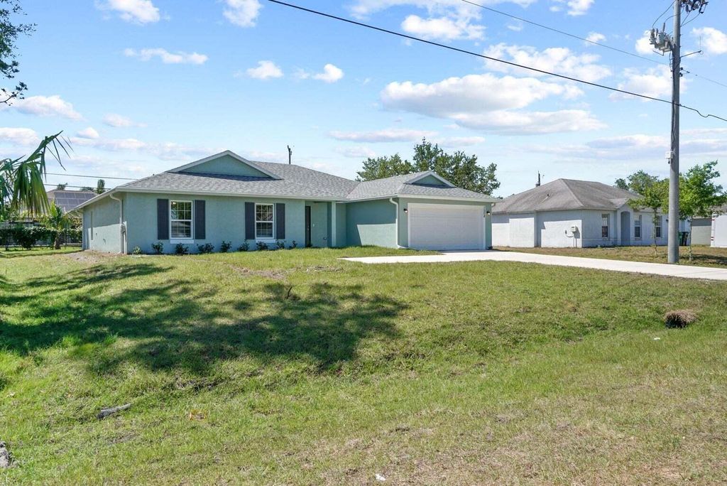 Photo of 1508 SW California Boulevard, Port Saint Lucie, FL 34953 (MLS # R10985171)